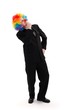 Business man wearing colorful clown wig