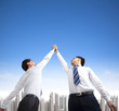 two businessmen with success gesture two businessmen with success gesture