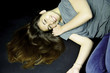 Girl with long hair on the ground