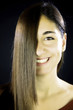 woman with straight hair in front of her face