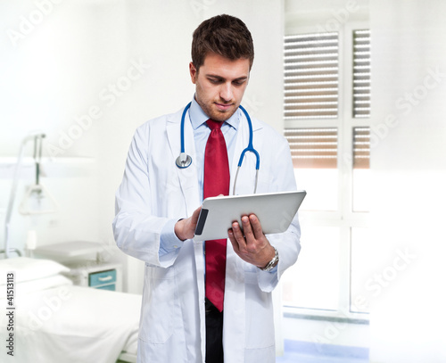 Photo: Doctor using a tablet pc Doctor using a tablet pc