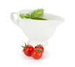 Three cherry tomatoes and pesto sauce