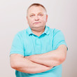 Senior man in shirt over white