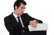 A businessman checking his watch.
