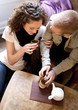 Couple is drinking tea in the living room.