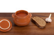 Soup in ceramic pot with bread and garlic Soup in ceramic pot with bread and garlic
