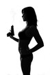 Silhouette of beautiful bondgirl with smoking gun Silhouette of beautiful bondgirl with smoking gun