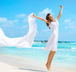 Beautiful Girl With White Scarf Jumping on The Beach