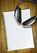 notepad and headphones