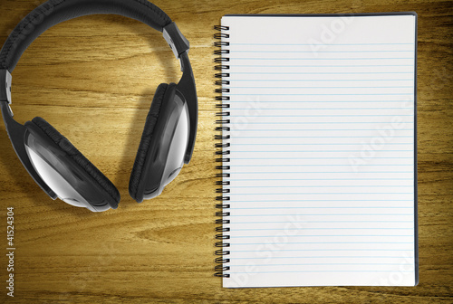 Photo: notebook and headphones notebook and headphones