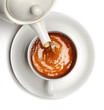 Tea being poured into tea cup