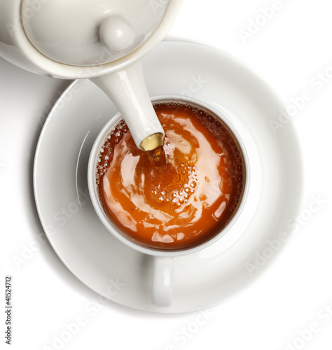 Photo: Tea being poured into tea cup Tea being poured into tea cup
