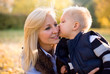 Attractive young mother with her son in the park.