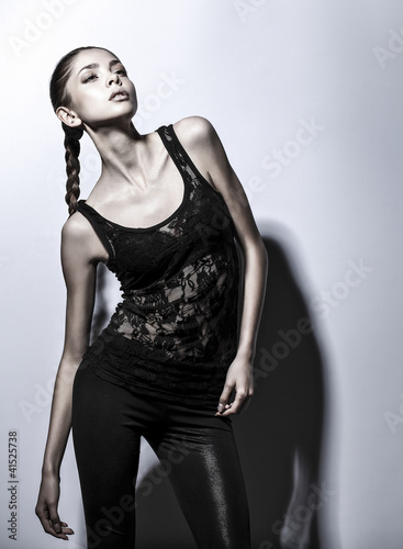 Foto: Young brunette lady in black dress Young brunette lady in black dress