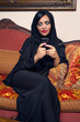 arabian lady with hijab having fun while chatting