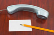 Phone, paper card and pencil Phone, paper card and pencil