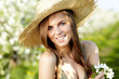beautiful woman standing near the apple tree