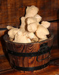 A Wooden Barrel Containing a Display of Root Ginger.