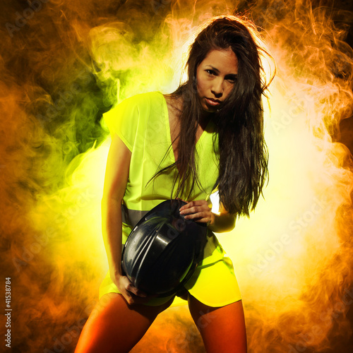 Photo: Sexy woman with safety jacket and helmet Sexy woman with safety jacket and helmet