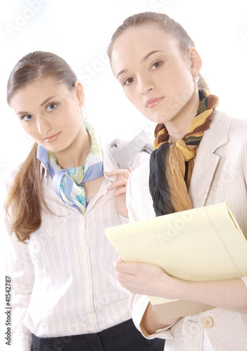Photo: Portrait of two beautiful young female business executives Portrait of two beautiful young female business executives