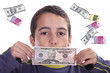 boy with dolares and euros, business studio photo boy with dolares and euros, business studio photo
