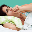 Portrait of an hispanic woman coughing