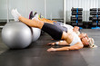 group of young people workout in gym with fitness balls