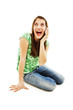 Excited young woman with phone, white background
