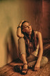 girl sitting on wooden floor