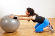 Pretty brunette exercising with ball