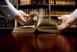 Hand on Book in Library