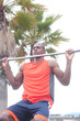 portrait of an African American athlete doing pullups