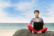Beautiful woman with laptop at the beach Beautiful woman with laptop at the beach