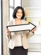 businesswoman with direction arrow sign