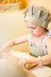 Little girl start cooking pizza