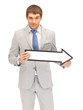 businessman with direction arrow sign