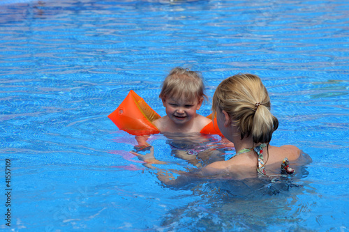 Photo: Girl with her mother in the swimming pool Girl with her mother in the swimming pool