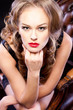 Young elegant girl sitting in chair