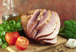 Ham and vegetables on a cutting board.
