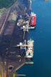 overhead view of ships loading coal in harbour overhead view of ships loading coal in harbour