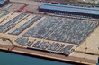 aerial view of large amount of automobiles parked at harbour aerial view of large amount of automobiles parked at harbour