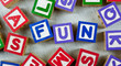 Wooden blocks forming the word FUN in the center