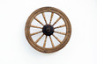 Vintage Spinning Wheel on White Wall