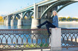 Beautiful woman with bridge on the background Beautiful woman with bridge on the background