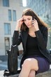 Business woman calling phone - problems Business woman calling phone - problems