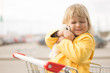Adorable baby sit in supermarket cart