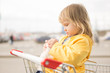 Adorable baby sit in supermarket cart