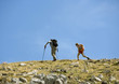 Hikers on mountainous landscape
