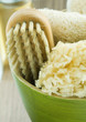 Bowl containing bath sponges and brush