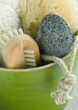 Bowl containing bath sponges, brush and pumice stone